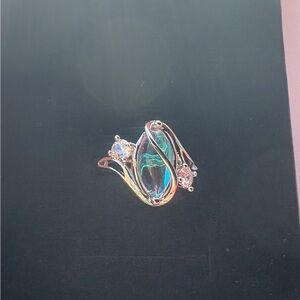 Mystic Moonstone Twist Ring – Sterling Silver Elegance